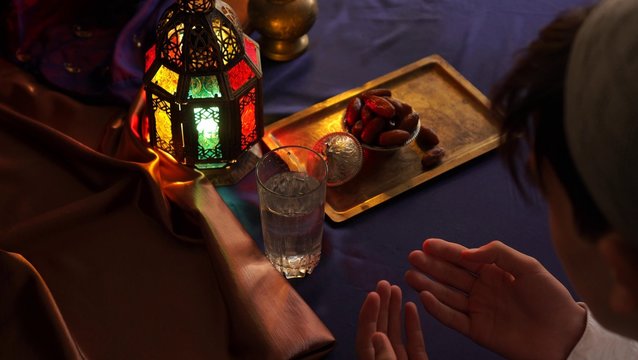 Religious muslim man praying. The night of wishes (sometimes night of rewards) (Laylat-ur Raghaeb) is a Muslim tradition