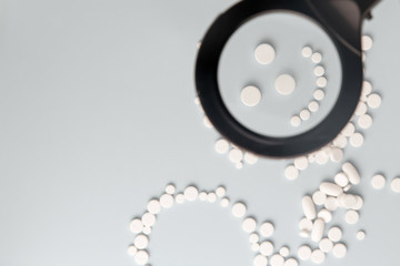 smiling face made of pills, copy space for text.