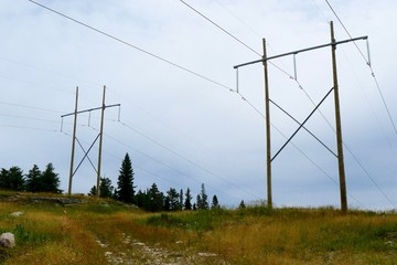 Hydroelectric power lines in a clearing in rural northern Ontario, Canada