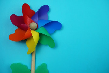 colorful pinwheel with space copy isolated on blue background