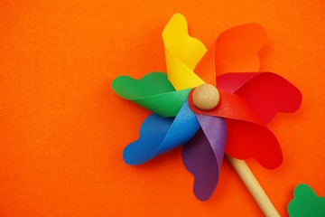 colorful pinwheel with space copy isolated on orange background