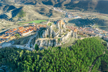 Aerial view of the fortress above Morella Spain with large pine trees
