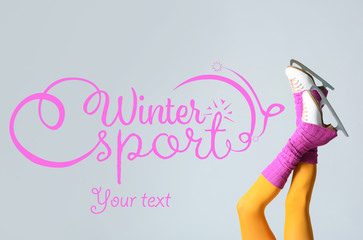 Obraz na płótnie Canvas Young woman on ice skates and text WINTER SPORTS on grey background