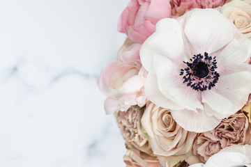 Obraz na płótnie Canvas Anemone and carnation flower flatlay feminine floral background top view