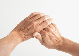 Fototapeta premium The hands and fingers of people Old with a problem showing sickness on a white background