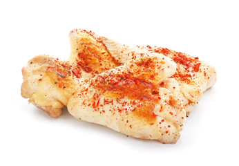 Cooked chicken wings on white background