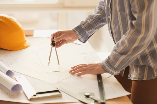 Female architect working in office