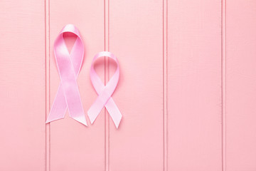 Pink ribbons on white wooden background. Breast cancer awareness concept