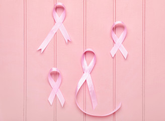 Pink ribbons on white wooden background. Breast cancer awareness concept