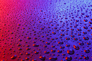 Water drops on color background