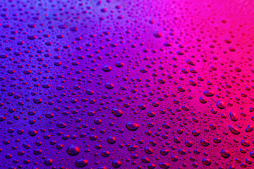 Water drops on color background
