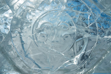 Obraz premium Texture of transparent ice with a pattern and cracks.
