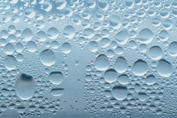Condensation abstract water drops on the window glass