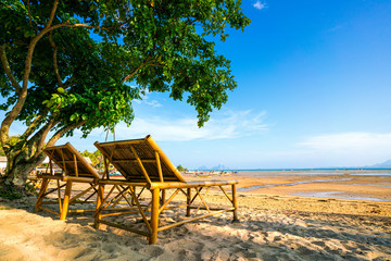 A twin bamboo bed on the cosy beach at southern of Thailand