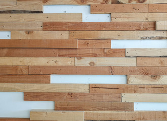 Horizontal line random pattern of brown pine wood decorated on white color concrete wall for interior decor