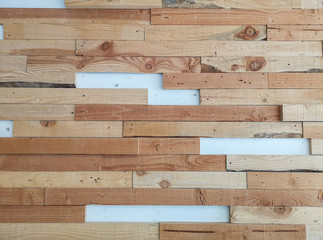 Horizontal line random pattern of brown pine wood decorated on white color concrete wall for interior decor