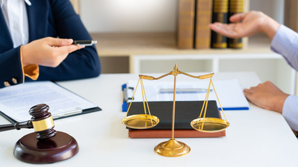 Women lawyer discussing with clients in courtroom. justice and law ,attorney, court judge, meeting concept