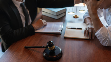 Male Notary lawyer or judge consult or discussing contract papers with Businessman client in...