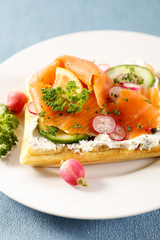 waffle with cream, vegetable and salmon fillet
