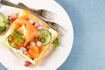 waffle with cream, vegetable and salmon fillet