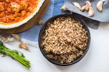 Buckwheat porridge in bowl, cooked. Traditional Russian grain food. Healthy vegan dietary lunch