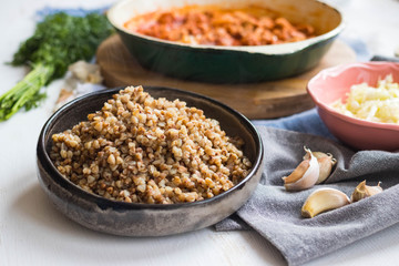 Buckwheat porridge in bowl, cooked. Traditional Russian grain food. Healthy vegan dietary lunch