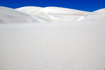 Fototapeta na wymiar White dune at the lava field of the volcano Caraci Pampa at the Puna de Atacama, Argentina