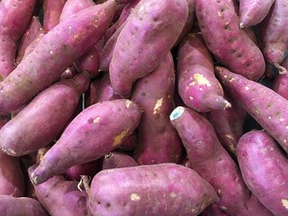 Fresh purple yams pile. Sweet potato. Fresh yams.