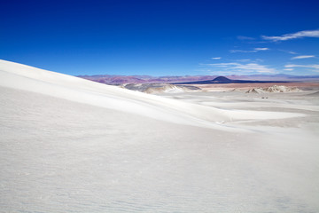 Fototapeta na wymiar Volcano Caraci Pampa and white dune at the Puna de Atacama, Argentina