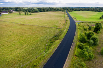 Top view of the road through the agricultural field