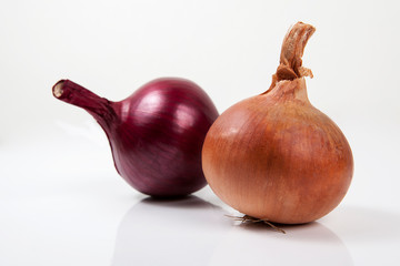 Onion on the white wooden table.