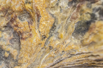 Sandstone with the remains of minerals and clay close-up. Macro photo