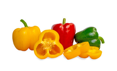 Raw fruit fresh yellow red and green sweet chili and sliced bell pepper with water droplets on smooth vivid skin, organic cooking ingredient isolated on white background, die cut with clipping path,
