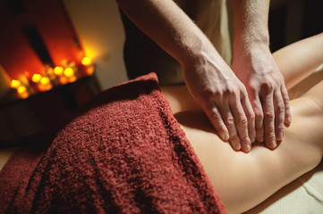 Men's premium luxury hip massage anti-cellulite wellness center. Close-up of a male masseur doing...