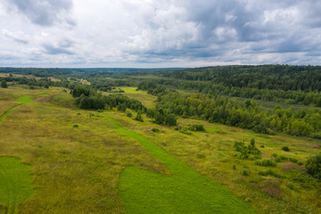 Top view of a hilltop surrounded by forest