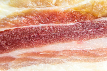 Close-up of jamon meat and fat. Macro photo