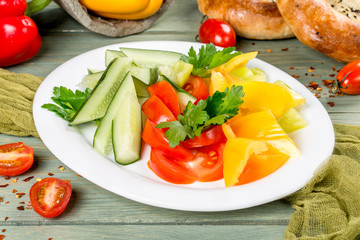 Vegetable plate with cucumbers, tomatoes and peppers
