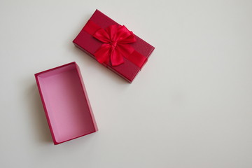 Directly above shot of red open gift isolated on white background