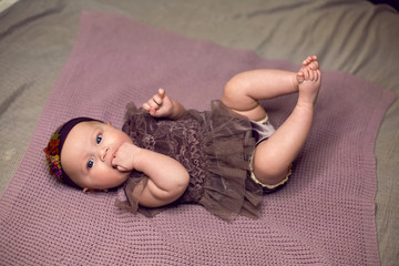 newborn baby is lying on the bed