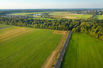 Aerial view of the road through the agricultural field