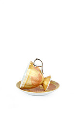 Luxurious designed tilt Tea cup & Plate isolated on white