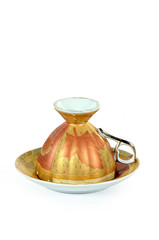 Luxurious designed upside down Tea cup & Plate isolated on white