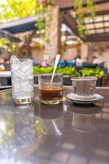 Vietnamese traditional brewed milk coffee with dripping filter