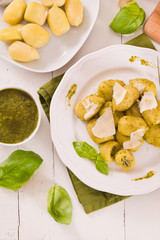 Potato gnocchi stuffed with pesto sauce.