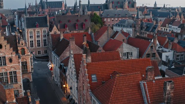 Belgium, Bruges: aerial view of cute red roof tile on houses in the center of city, overlooks the rozenhoedkaai street
