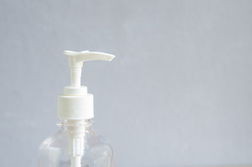 Fototapeta na wymiar White bottle alcohol gel hand scrub.