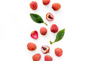 Lychee pattern. Exotic asian fruits on white background top-down copy space