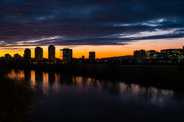 Fototapeta premium Sunset over Sava river in Zagreb, Croatia, dramatic cloudy sky 