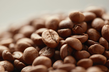 Roasted coffee beans close up. Espresso dark, aroma, black caffeine drink