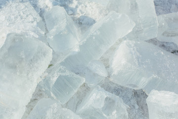 Amazing abstract broken ice crystals texture. Clear melting ice background.